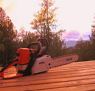 chainsaw at sunset